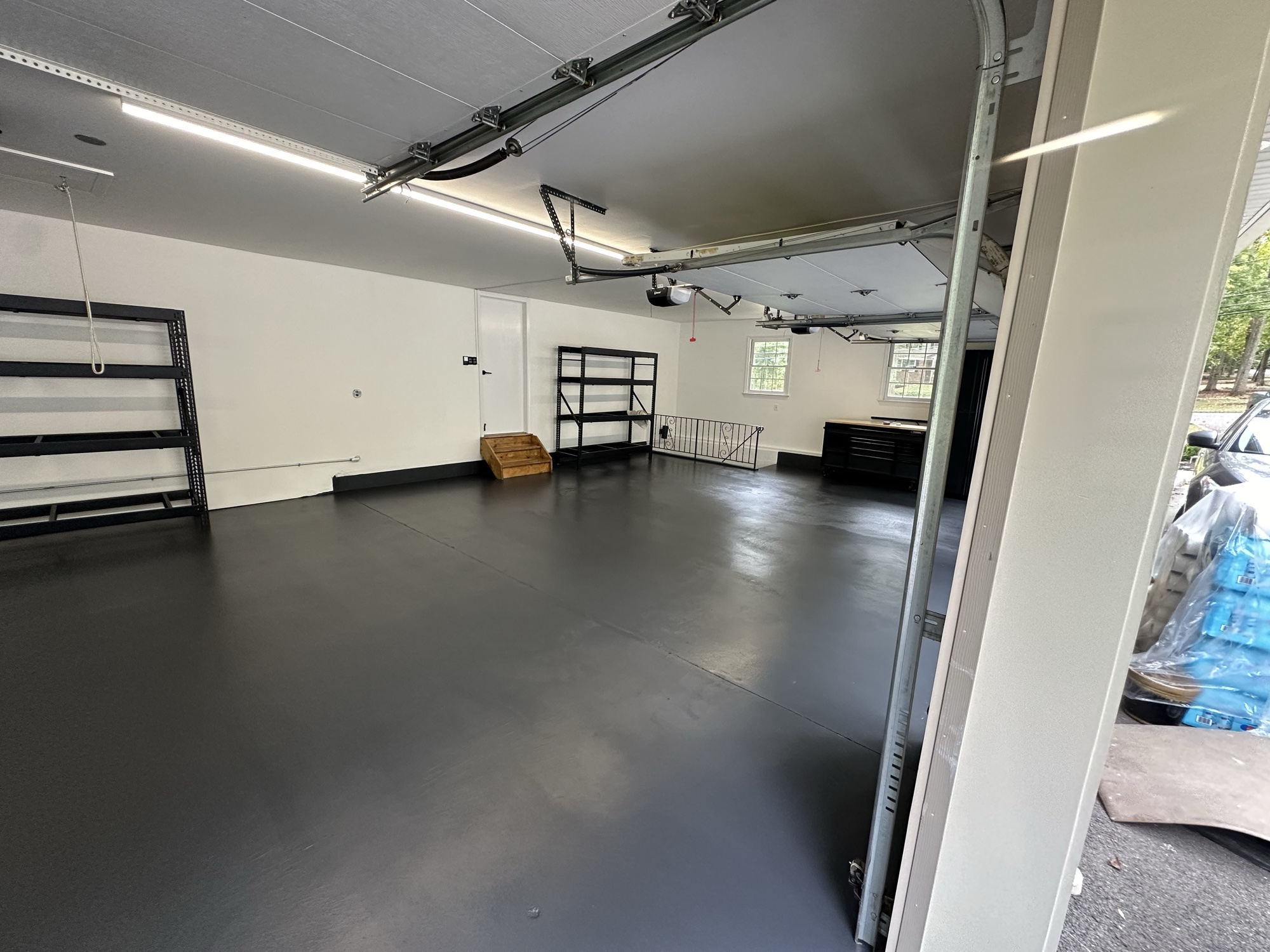 Sleek dark gray epoxy garage floor coating