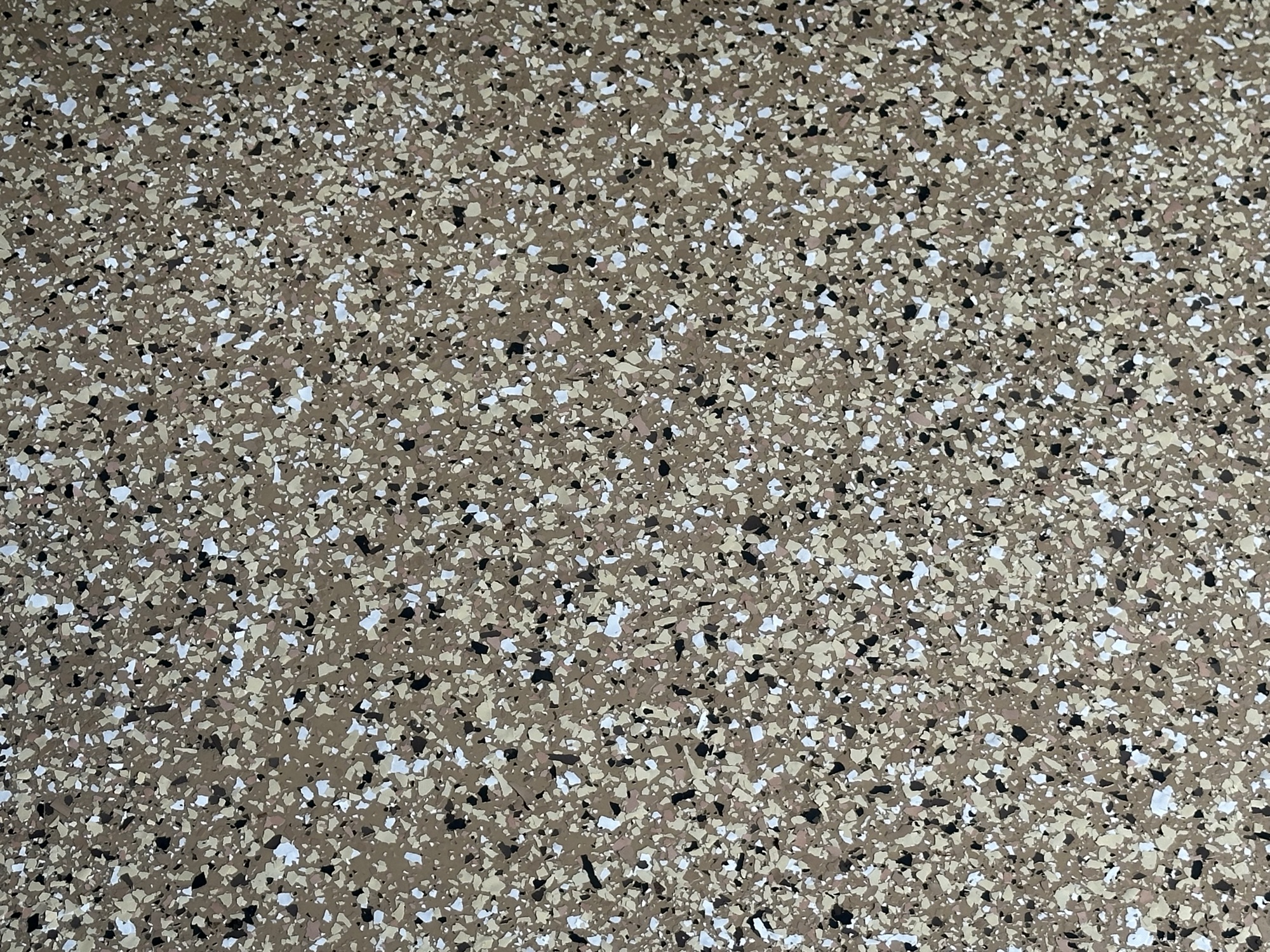 Epoxy floor close-up showing brown flake texture detail