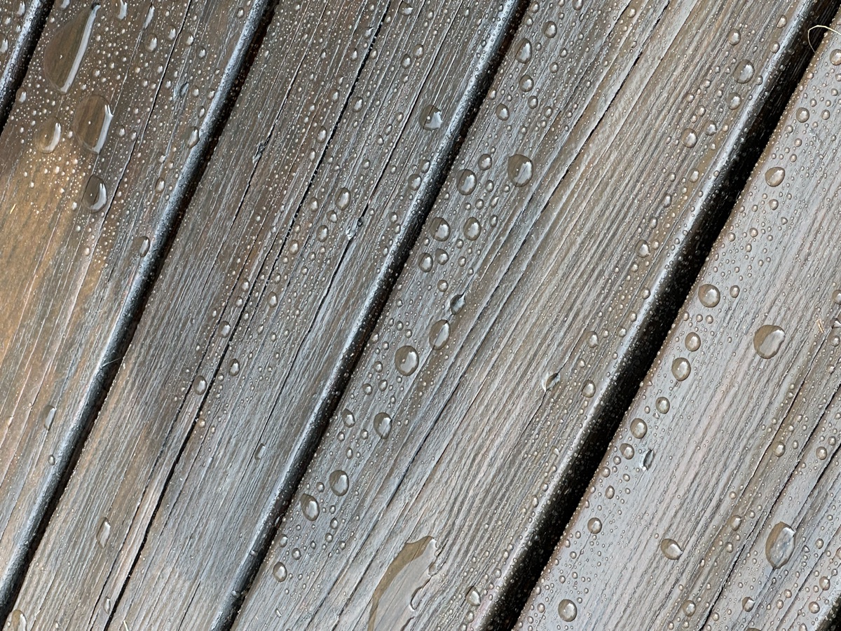 Water beading on sealed deck boards close-up by J&B Painting