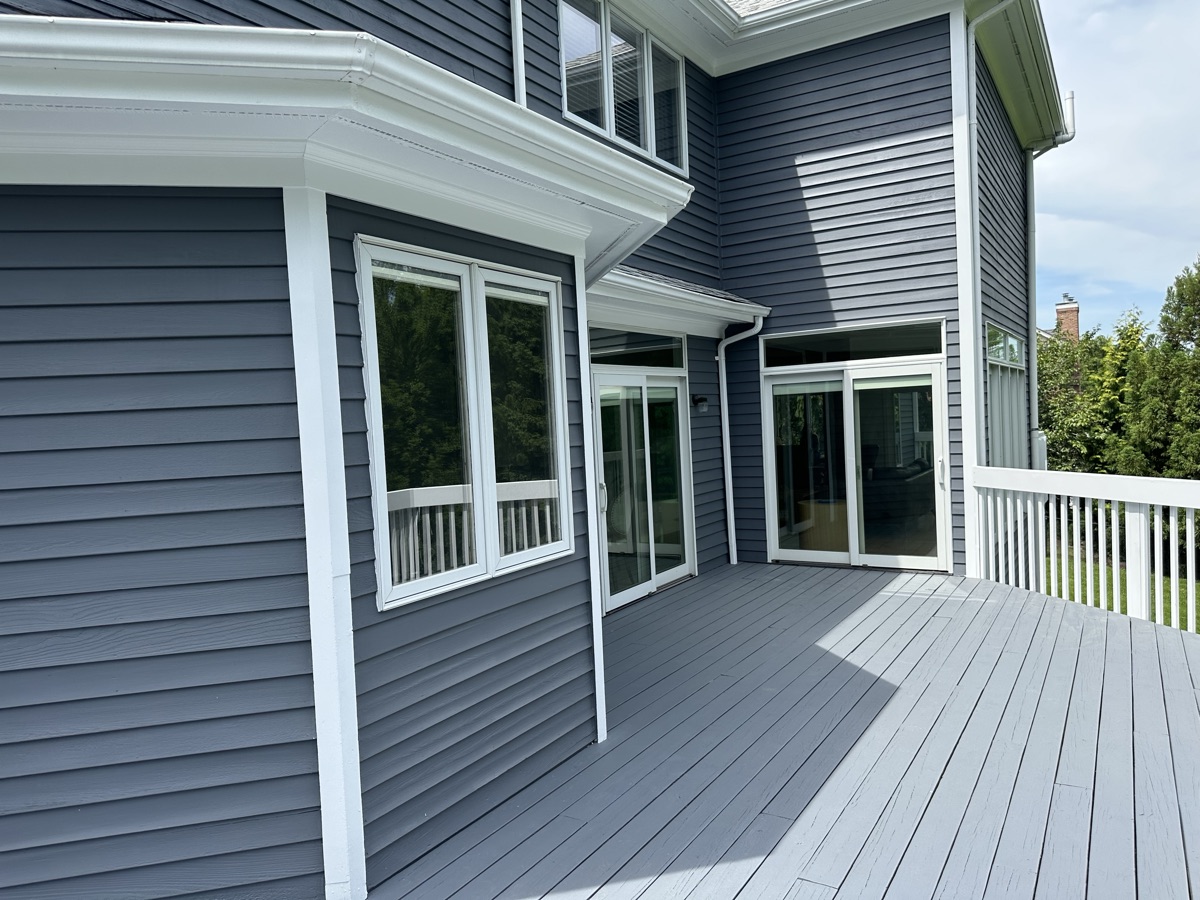 Gray painted deck with sliding glass doors