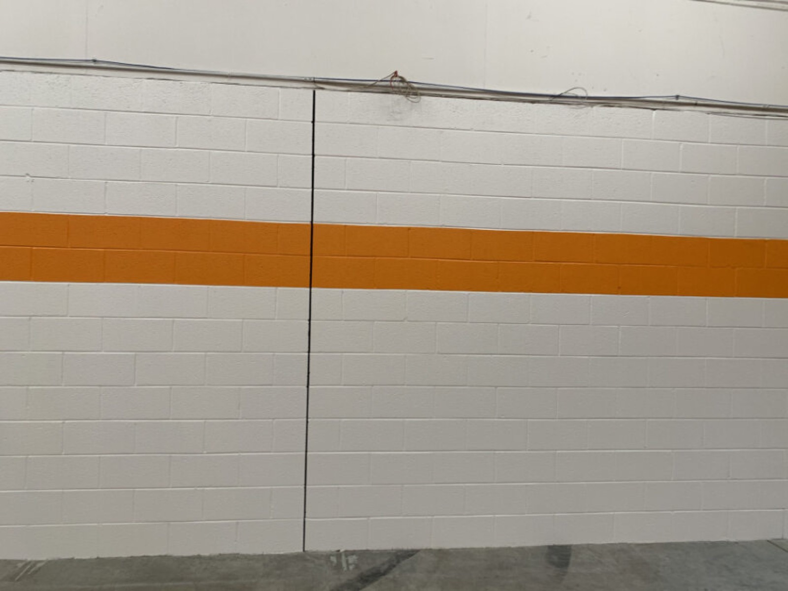 Commercial interior with orange accent stripe detail