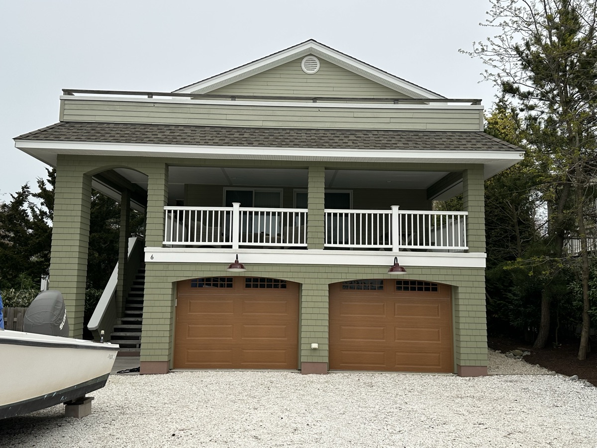 Green coastal home with balcony alternate view