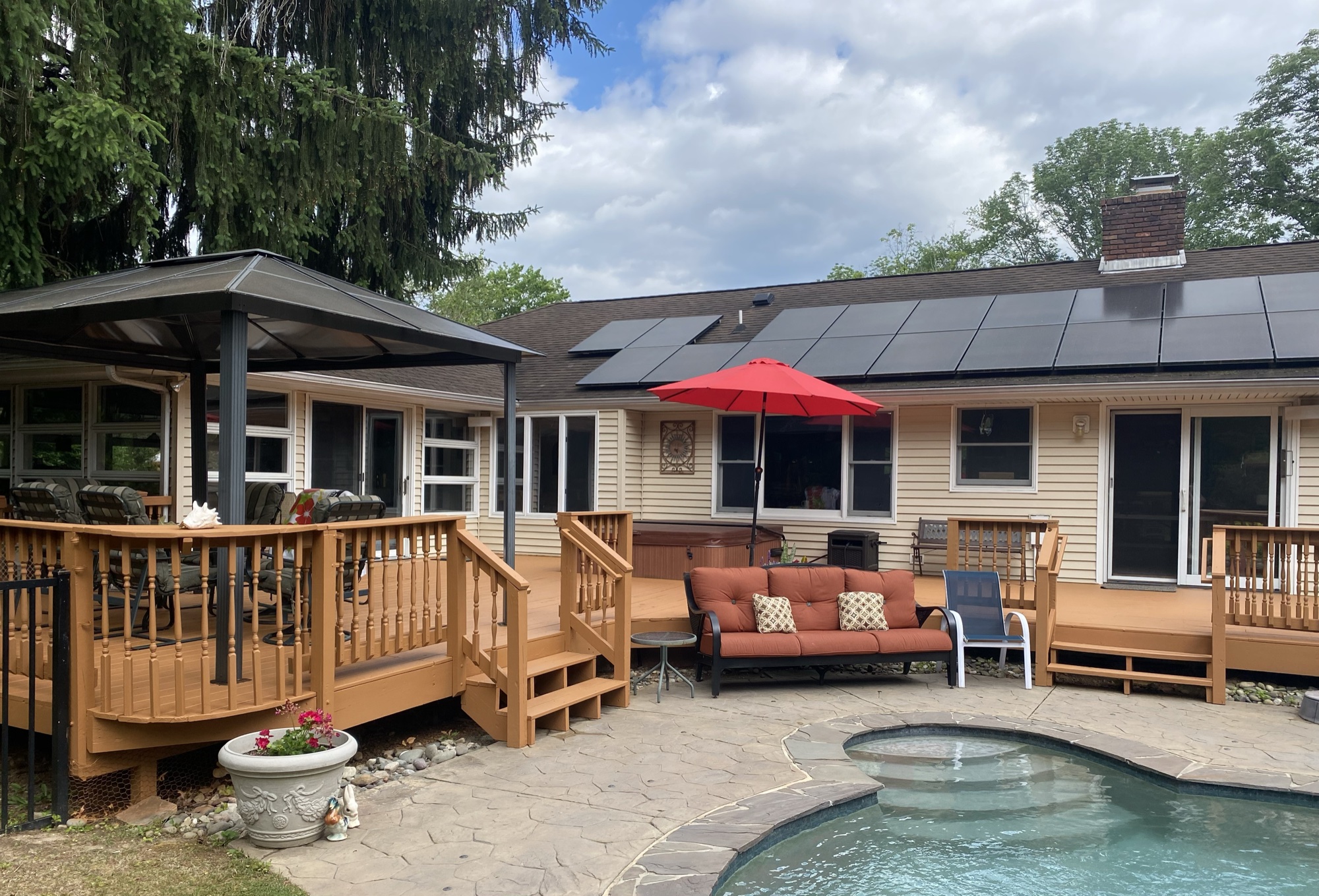 Pool house with professionally stained deck
