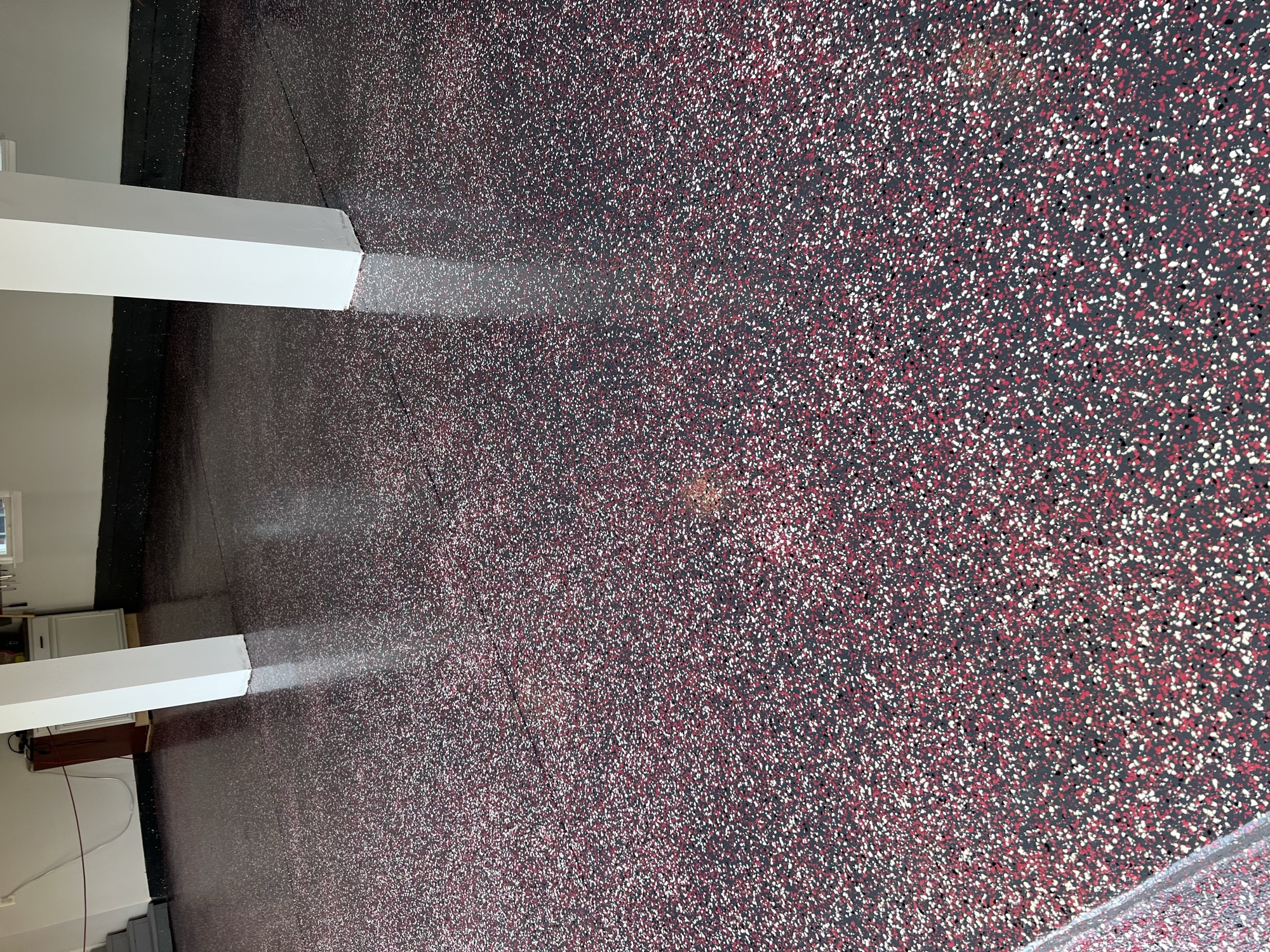 Flake floor finish with decorative epoxy coating